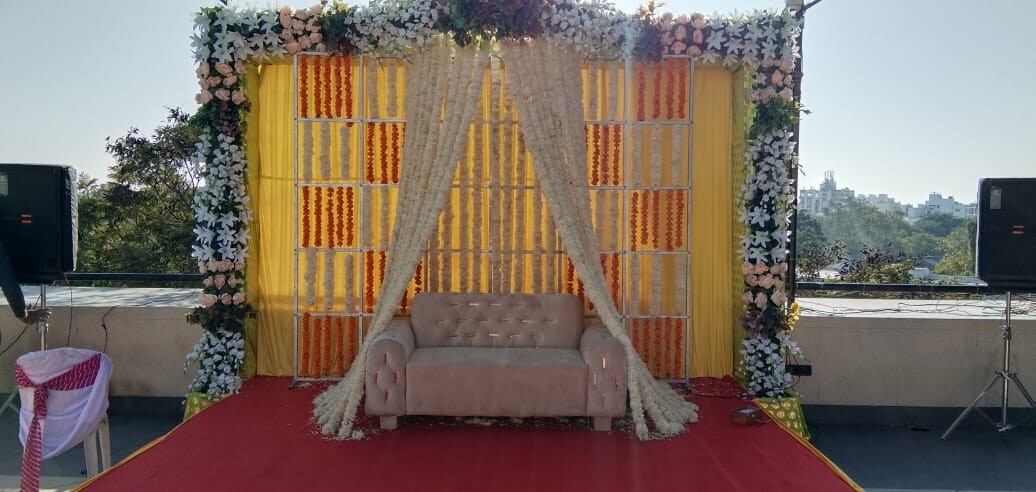 Beautifully decorated wedding stage at Hotel Aram